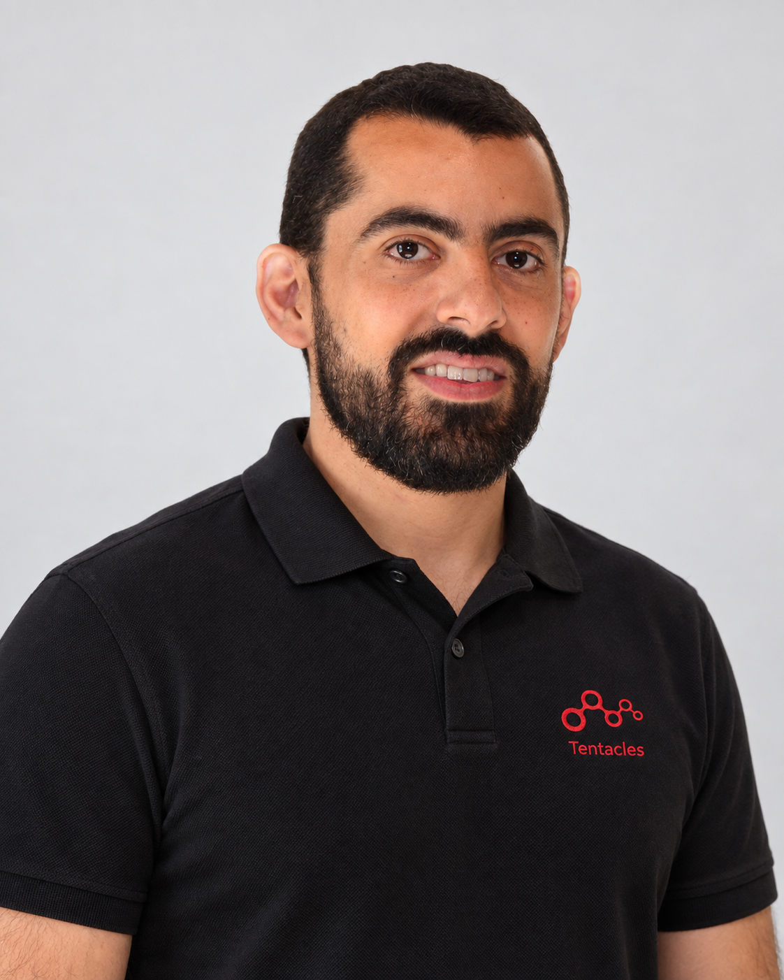 Tentacles owner wearing a black polo with the red Tentacles logo